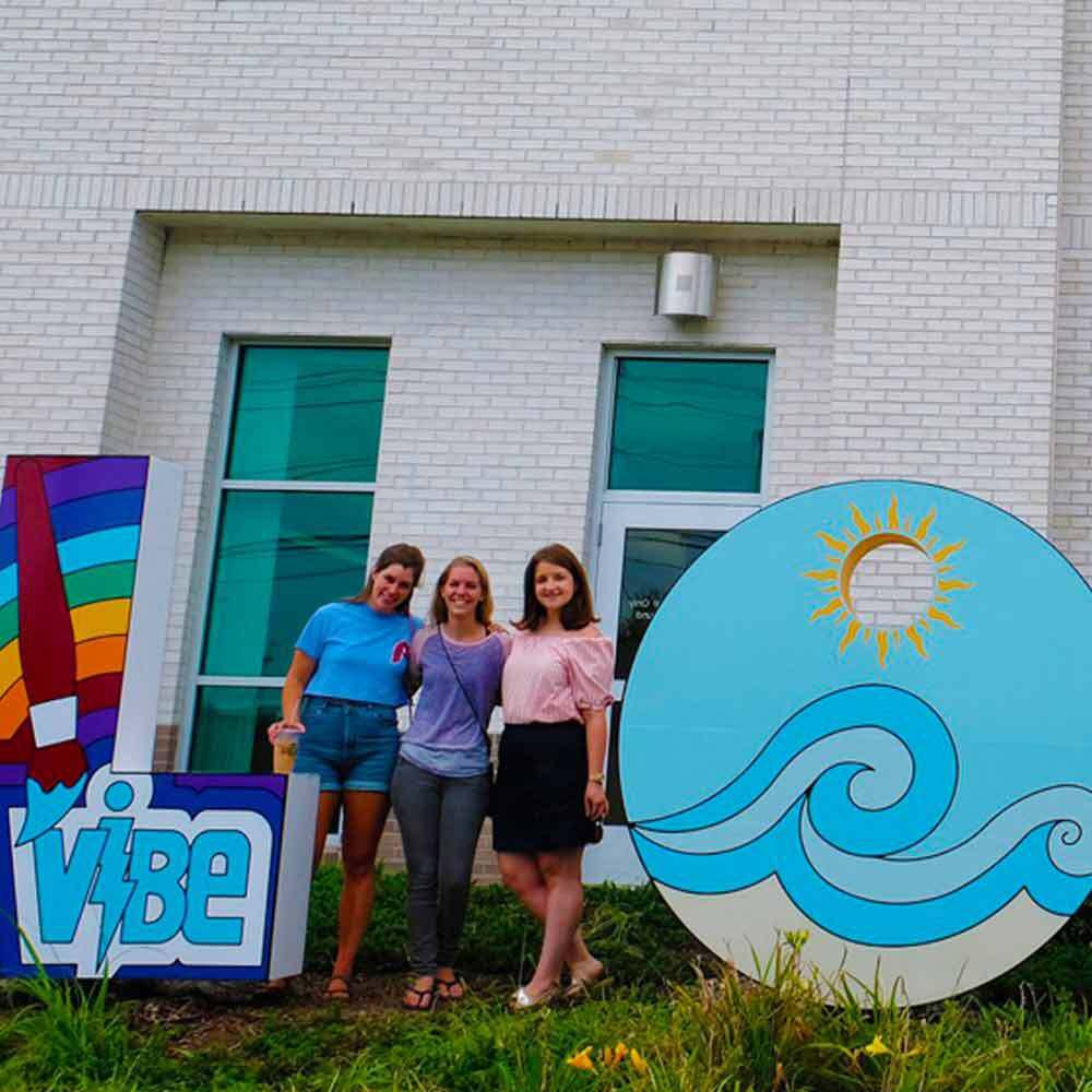 Students Standing in Front of a Love Sign