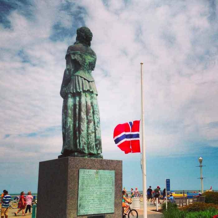 Norwegian Lady with Flag at Half Mast