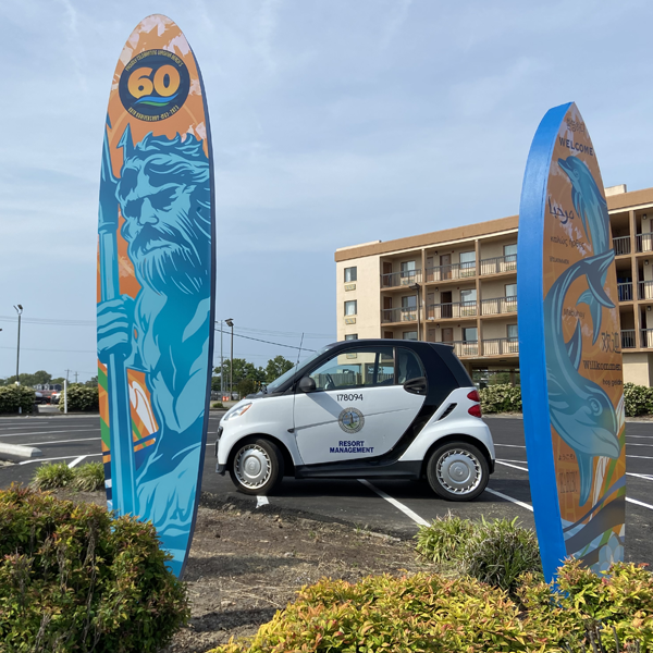 VB 60th Surfboards with City Car Between Them