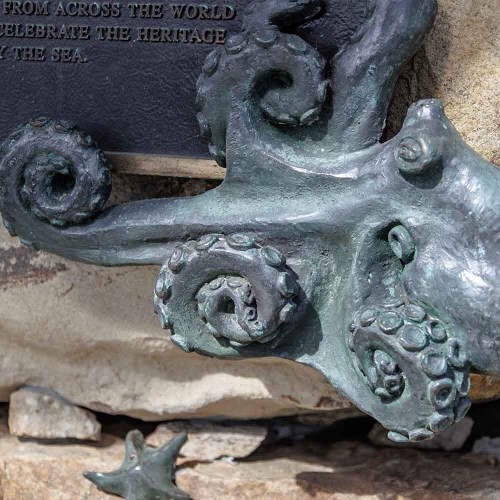 Octopus at the Base of King Neptune Sculpture